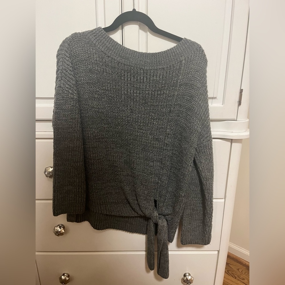 Grey boutique sweater with tie detail on the front